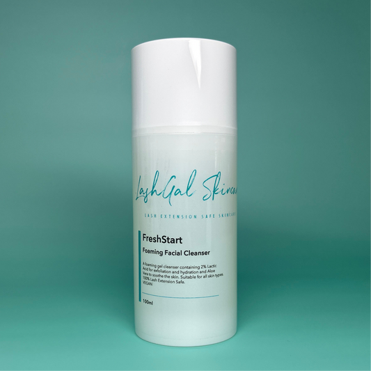 Foaming facial cleanser bottle with 'LashGal Skincare' branding on a teal background